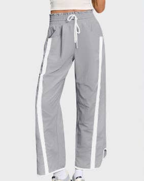 Gray sweatpants with white stripes on a white background