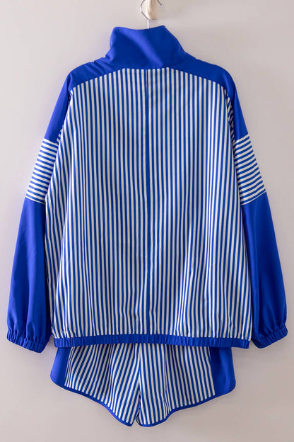 Blue and white striped jacket and pants set on a plain background