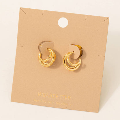 Gold hoop earrings on a 'WEARBETTER' branded card.
