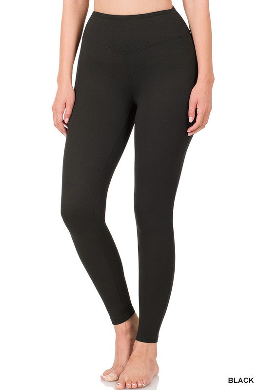 Black leggings worn by a person on a white background
