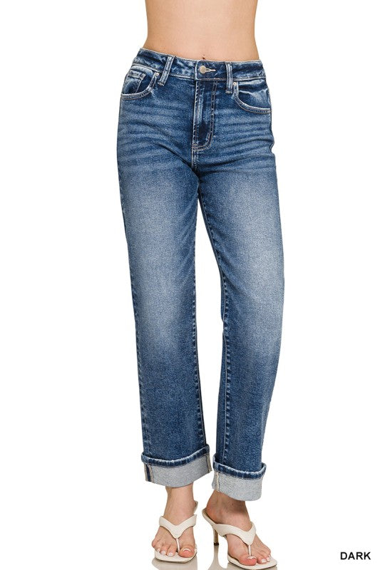 Blue jeans worn by a person on a white background