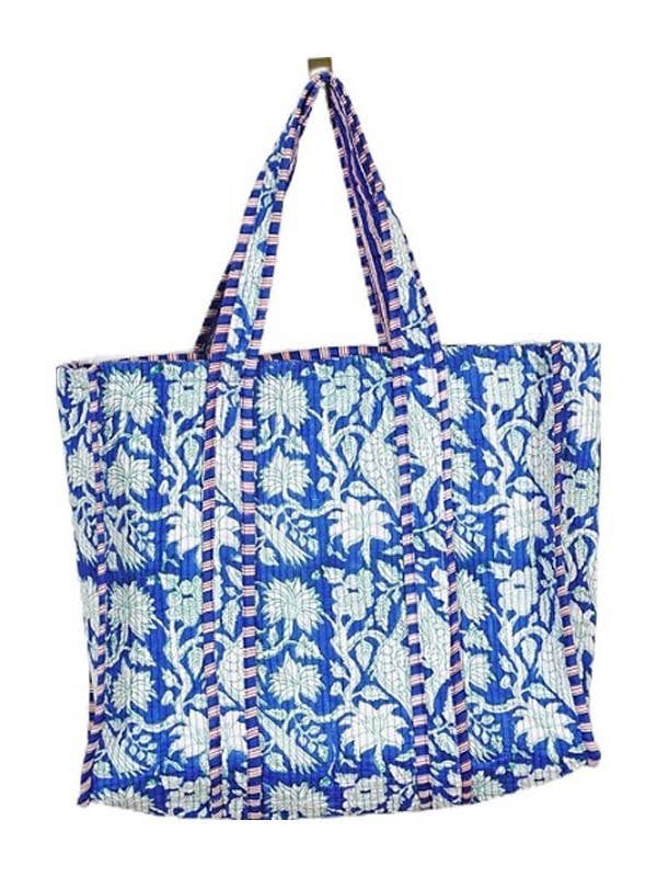 Blue and white floral patterned tote bag on a white background