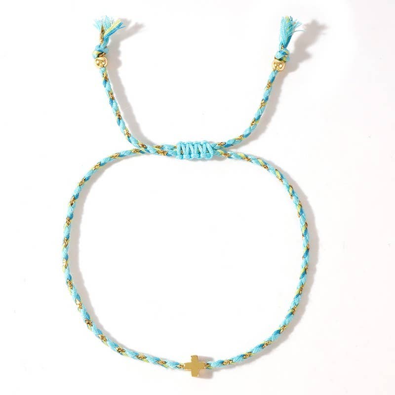 Turquoise braided bracelet with gold accents on a white background