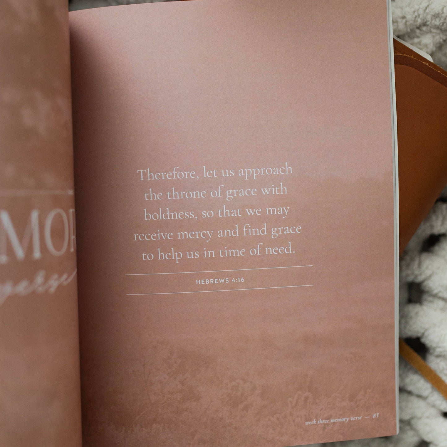 Open book with a quote on a textured surface