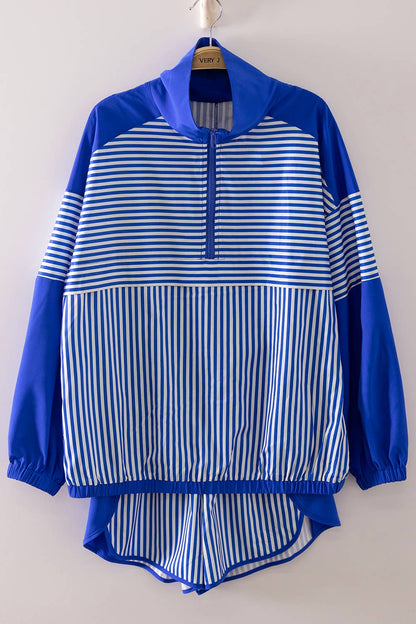 Blue and white striped jacket on a hanger against a plain background