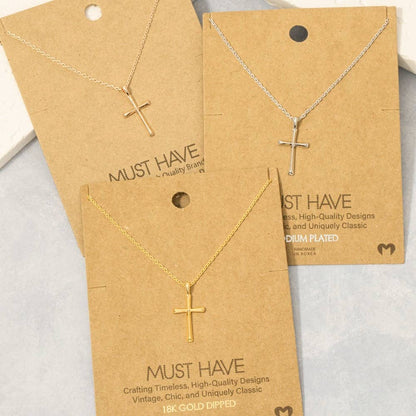 Gold cross necklaces on 'Must Have' branded cards with gold plating details.