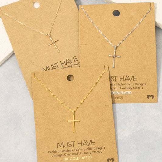Gold cross necklaces on 'Must Have' branded cards with gold plating details.