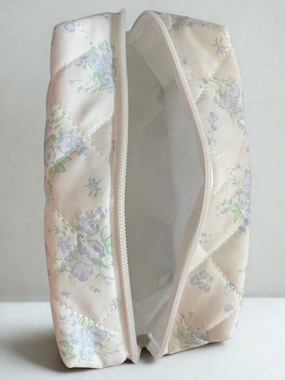 Floral-patterned makeup bag on a white background