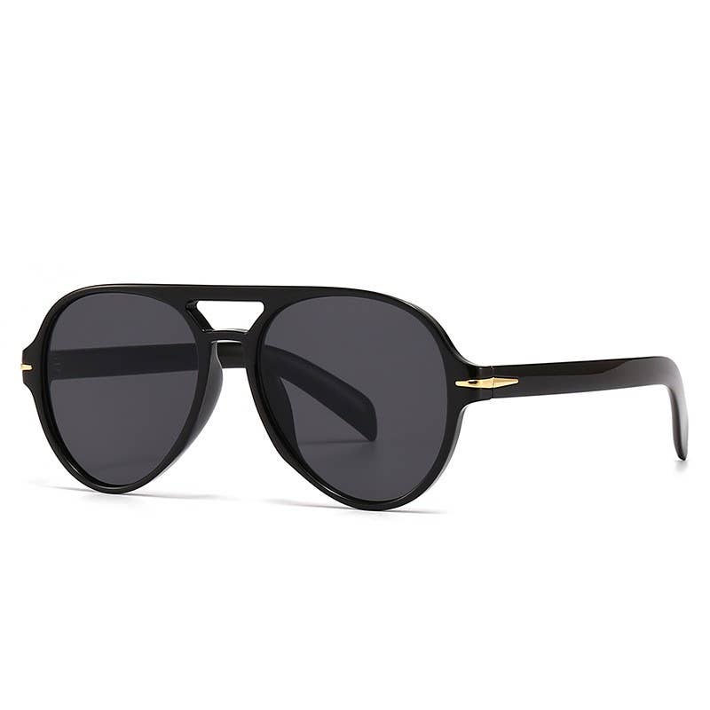 Black sunglasses with gold accents on a white background