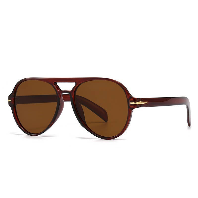 Brown sunglasses with a gold frame on a white background