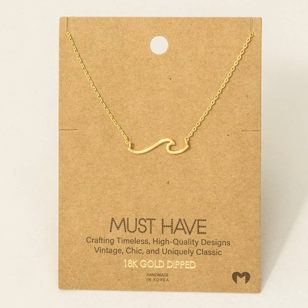 Gold necklace on a brown card with 'Must Have' branding